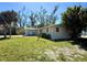 Charming one-story home featuring a well-maintained lawn and mature trees in a serene setting at 1170 Little Ct, Englewood, FL 34223