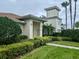 Inviting home with a tile roof, manicured landscaping, and a charming tower feature at 1204 L Pavia Blvd # 1204, Venice, FL 34292