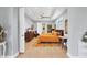 An inviting bedroom features tray ceilings, a ceiling fan, neutral walls, and a large bed with decorative pillows at 1207 Henning St, North Port, FL 34288