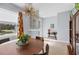 An inviting dining room features decoratice lighting fixture and accent wall design near the entrance at 1207 Henning St, North Port, FL 34288