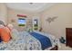 Bright bedroom with water view, lanai access and designer touches at 12127 Granite Woods Loop, Venice, FL 34292