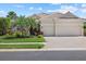 Charming home with well-maintained landscaping, two-car garage, and inviting curb appeal at 12127 Granite Woods Loop, Venice, FL 34292