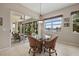 Cozy living room overlooking the lake and pool area at 12127 Granite Woods Loop, Venice, FL 34292