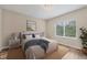 Cozy bedroom featuring a jute rug, natural light and pleasing decorative elements at 12198 Sebring Ln, Venice, FL 34293