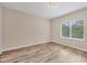 Bright bedroom features wood floors and lots of natural light at 12198 Sebring Ln, Venice, FL 34293