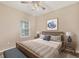 Comfortable bedroom featuring neutral tones, a ceiling fan and coordinated furniture at 12198 Sebring Ln, Venice, FL 34293