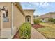 Inviting home entrance with brick walkway and landscaping, featuring the house number at 12198 Sebring Ln, Venice, FL 34293