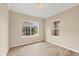 Empty room with wood floors and a window looking outside at 12198 Sebring Ln, Venice, FL 34293