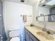 Bright bathroom featuring a vanity with unique sink and shower with curtains at 1255 Tarpon Center Dr # 503, Venice, FL 34285