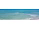 A beautiful beach with light blue water rolling onto the sandy shore at 1255 Tarpon Center Dr # 503, Venice, FL 34285
