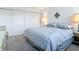Comfortable bedroom featuring ample closet space and soft, inviting bedding at 1255 Tarpon Center Dr # 503, Venice, FL 34285