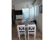 Cozy dining room area with table and chairs leading into the kitchen at 1255 Tarpon Center Dr # 503, Venice, FL 34285