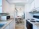 Bright kitchen with granite countertops leading to a cozy dining area at 1255 Tarpon Center Dr # 503, Venice, FL 34285