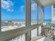 A bright sunroom offering beautiful views of the ocean and beach at 1255 Tarpon Center Dr # 503, Venice, FL 34285
