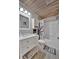 Charming bathroom featuring updated vanity, tiled walls, and tub/shower with an octopus themed shower curtain at 13534 Alberta Ave, Port Charlotte, FL 33981