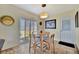 Cozy breakfast nook with natural light, a sliding glass door, and a table with seating at 13534 Alberta Ave, Port Charlotte, FL 33981