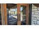 Elegant glass entryway into the recreational center, featuring welcoming signage and stone accents at 13534 Alberta Ave, Port Charlotte, FL 33981