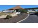 A well maintained exterior shows fresh landscaping, a covered entry, and convenient accessible parking at 13534 Alberta Ave, Port Charlotte, FL 33981