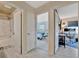 Hallway view of bathroom, bedroom, and office spaces at 13534 Alberta Ave, Port Charlotte, FL 33981