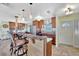 Bright kitchen featuring wooden cabinets, a breakfast bar with seating, and modern stainless steel appliances at 13534 Alberta Ave, Port Charlotte, FL 33981