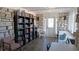 Cozy library filled with books, comfortable seating, and natural light at 13534 Alberta Ave, Port Charlotte, FL 33981