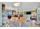 Open living space features kitchen, dining area, living room, wood cabinets, and modern appliances at 13534 Alberta Ave, Port Charlotte, FL 33981