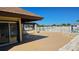 An outdoor patio, and partial view of the pool with a fenced perimeter for privacy and safety at 13534 Alberta Ave, Port Charlotte, FL 33981