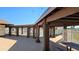 Covered outdoor patio with picnic tables, perfect for gatherings and overlooking community tennis courts at 13534 Alberta Ave, Port Charlotte, FL 33981