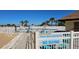 A well-maintained pool area with comfortable lounge chairs and clear signage for safety at 13534 Alberta Ave, Port Charlotte, FL 33981