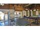 Well-equipped recreation room with ping pong table, pool table, and easy access to amenities at 13534 Alberta Ave, Port Charlotte, FL 33981