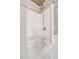 Shower/Tub combination featuring tile wall accents and grab bars at 13534 Alberta Ave, Port Charlotte, FL 33981