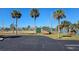 Palm tree lined tennis courts offer a fun recreational activity in a beautiful setting at 13534 Alberta Ave, Port Charlotte, FL 33981