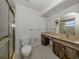 View of bathroom with shower, toilet, sink and vanity at 1602 Jim Jim Ct, Venice, FL 34293