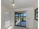 A bright breakfast nook with tile flooring, windows with view to the screened lanai and outdoor space at 1602 Jim Jim Ct, Venice, FL 34293