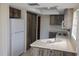 Bright kitchen featuring wooden cabinets and white appliances at 1602 Jim Jim Ct, Venice, FL 34293