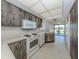 Bright kitchen features appliances, plenty of cabinet space, and access to the lanai at 1602 Jim Jim Ct, Venice, FL 34293
