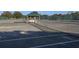 Full tennis court with benches and a gazebo at 1602 Jim Jim Ct, Venice, FL 34293