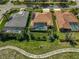 Aerial view of backyard featuring screened in pools, mature landscaping, and an outdoor living area at 1662 Bobcat Trl, North Port, FL 34288