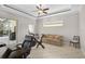 Bonus room with comfortable seating and exercise equipment at 1662 Bobcat Trl, North Port, FL 34288