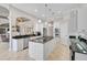 Bright kitchen boasts stainless appliances, granite counters, and an island with a gas cooktop at 1662 Bobcat Trl, North Port, FL 34288