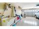Spacious garage featuring ample storage space, a utility sink, and access to the home's interior at 1683 San Silvestro Dr, Venice, FL 34285