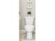 Bright bathroom features a white toilet and modern fixtures at 16848 Cayo Key Dr, Port Charlotte, FL 33953