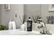 Sleek bathroom featuring granite countertops, modern fixtures, and stylish accessories at 16848 Cayo Key Dr, Port Charlotte, FL 33953