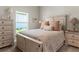 Bright bedroom featuring a serene view from the window, neutral tones, and stylish furnishings at 16848 Cayo Key Dr, Port Charlotte, FL 33953