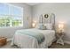 Charming bedroom with natural light, decorative headboard, and tasteful furnishings at 16848 Cayo Key Dr, Port Charlotte, FL 33953