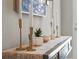 Elegant console table decorated with candles and decorative greenery at 16848 Cayo Key Dr, Port Charlotte, FL 33953