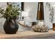 Chic decorative arrangement featuring a modern vase, candle, and stylish mirror at 16848 Cayo Key Dr, Port Charlotte, FL 33953