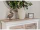 Home decor includes a pelican figurine and a framed 'Happy Home' message on a console table at 16848 Cayo Key Dr, Port Charlotte, FL 33953