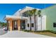 Bright, modern building featuring colorful design elements and a welcoming entrance with palm trees at 16848 Cayo Key Dr, Port Charlotte, FL 33953