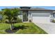 Beautiful home with a well-manicured lawn, nice walkway and a two-car garage at 16848 Cayo Key Dr, Port Charlotte, FL 33953